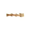 Full view of a wooden mechanical dragon model with movable joints, created for Green Robot Tech's STEAM learning kits.