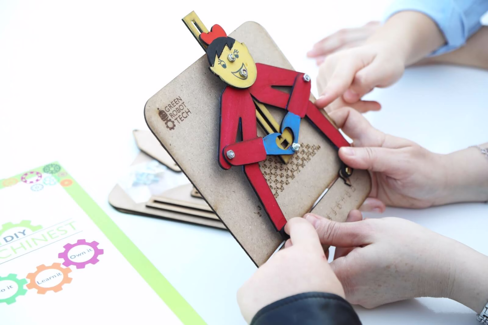 Child playing with an eco-friendly STEAM kit after painting it.