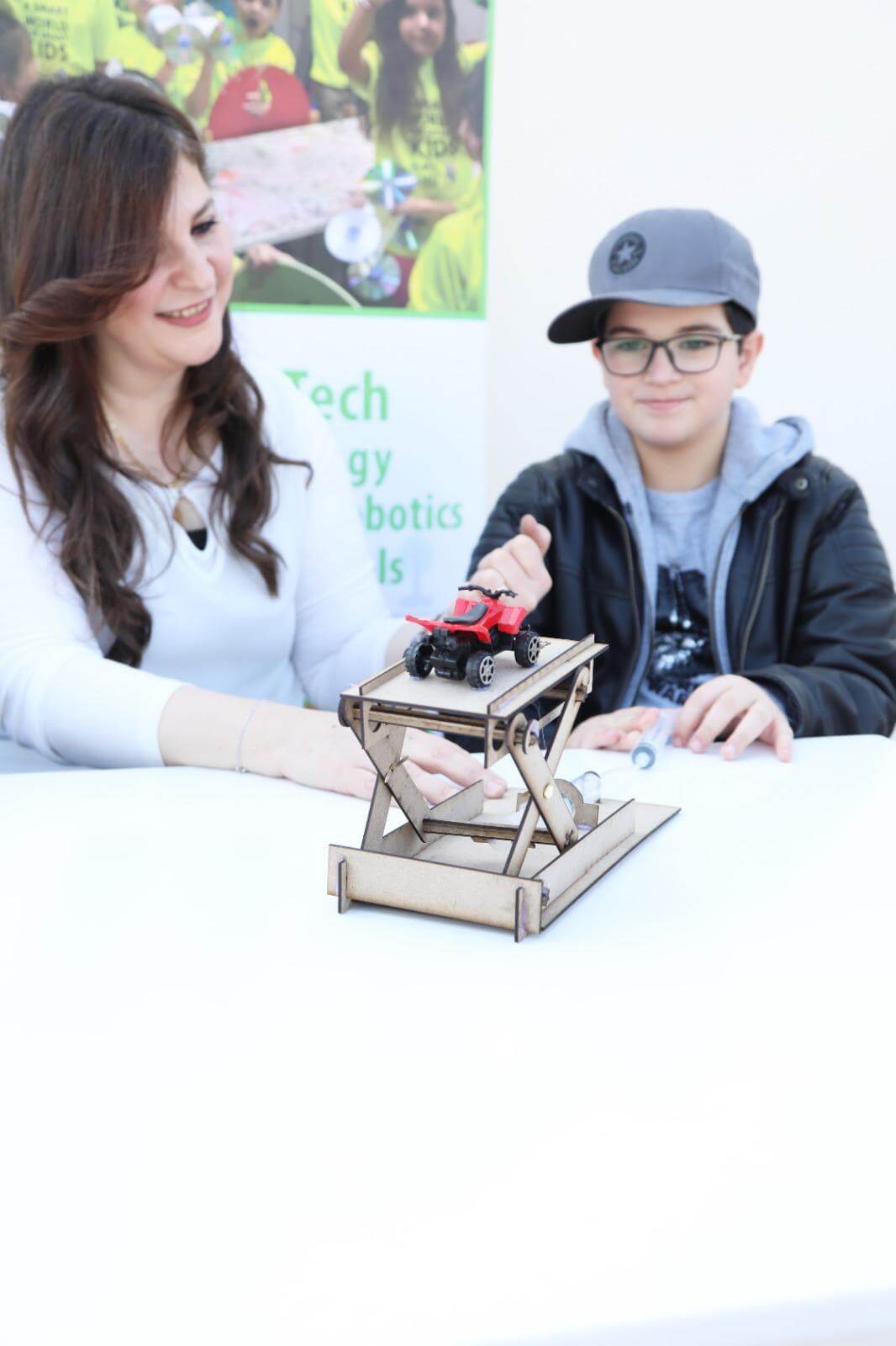 CEO showing kid how the kit works