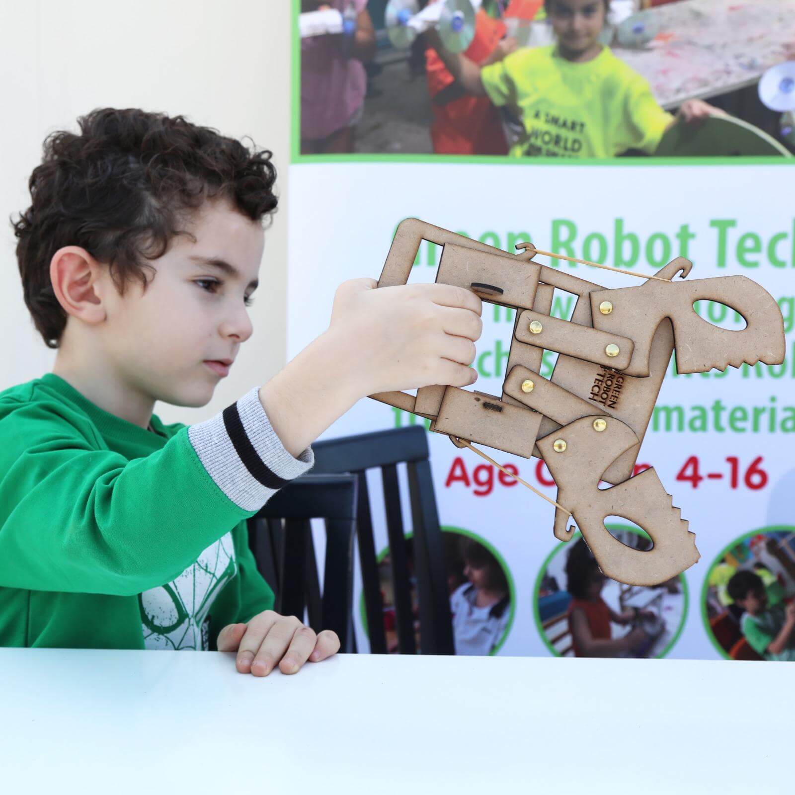 A boy testing his Mechanical claws STEAM kit