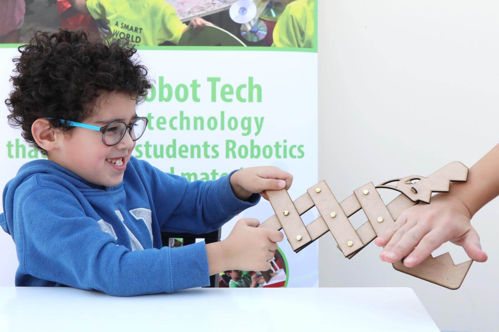 A boy showcasing and playing with his Dragon kit