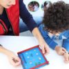 Parent and child playing with Pin Ball kit