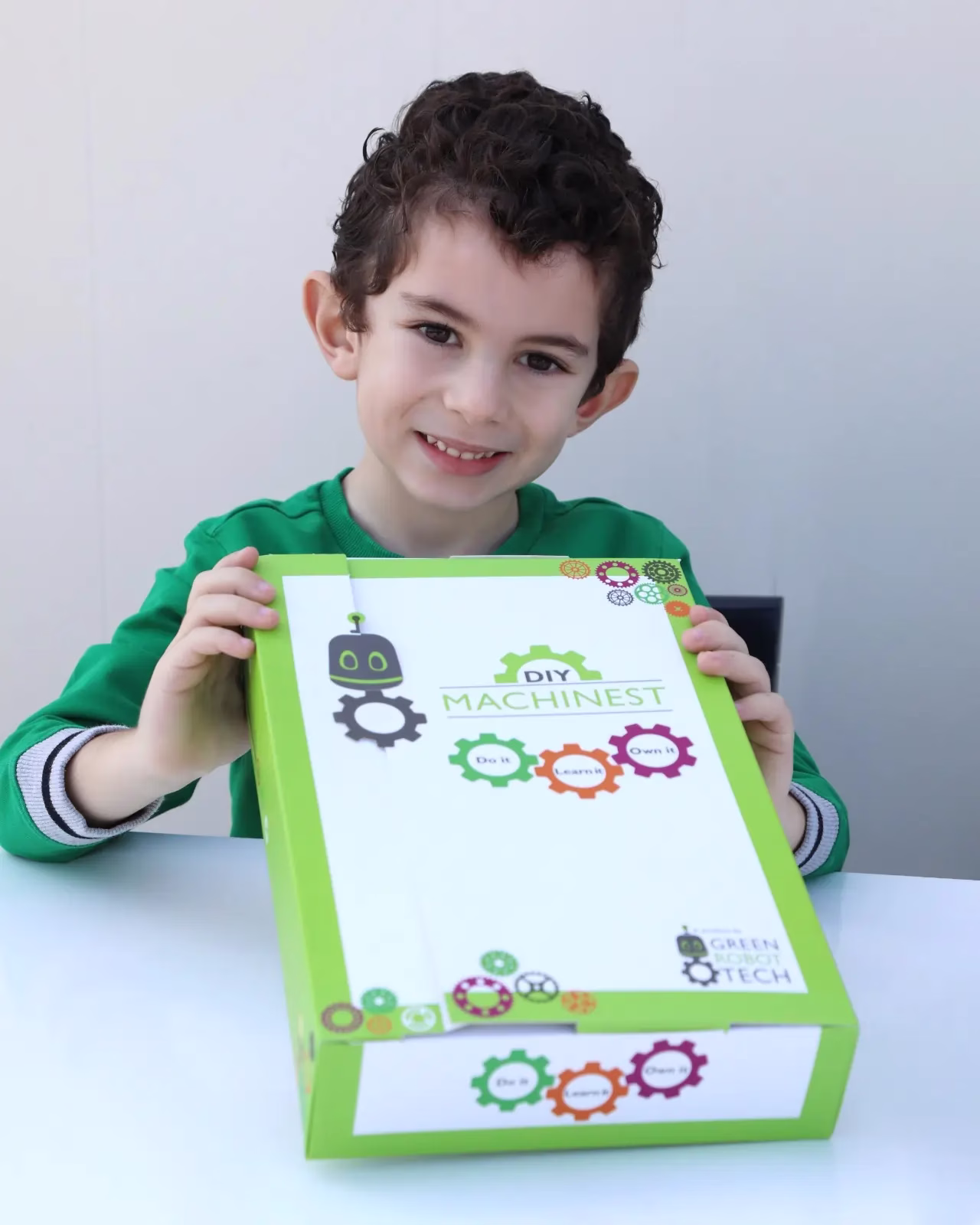 child holding an eco friendly grt kit